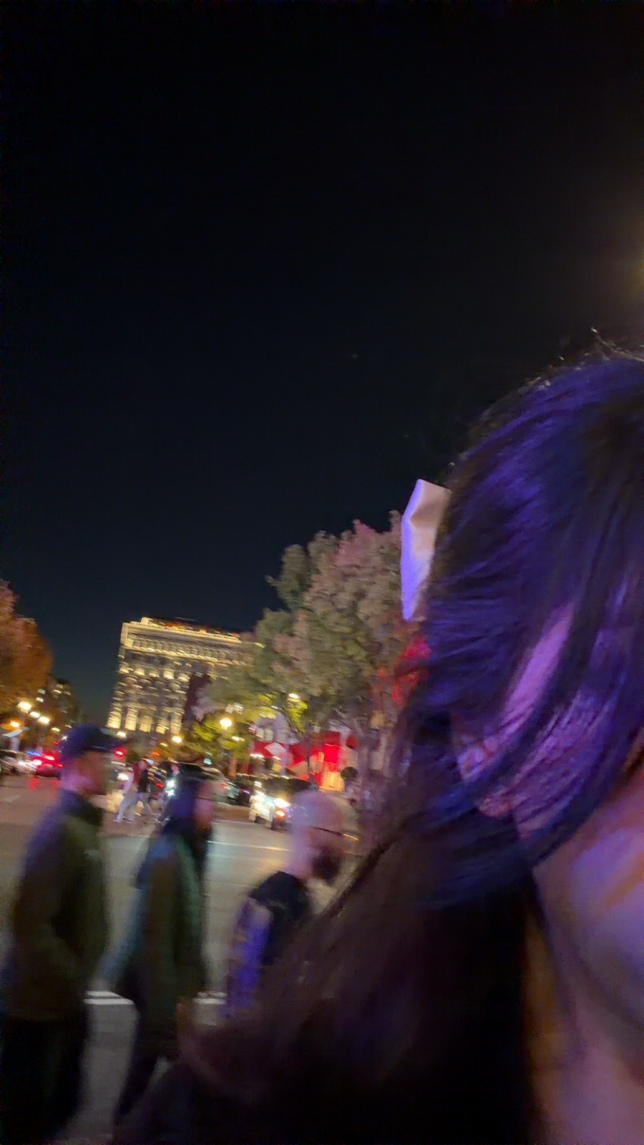 Figure 05. My hair was blowing across the streets of Chinatown in DC, a bow clipped into my hair to match the hundreds of others in the line, waiting to see Laufey for her ‘A Matter of Time’ concert. (Original Photo, Gunjan Rekhi)

